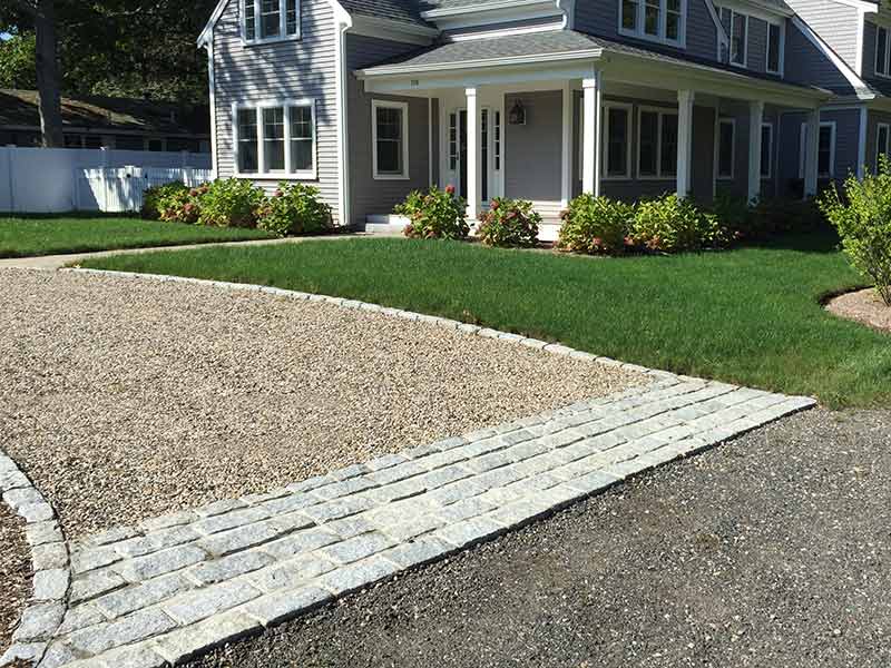 A crushed stone driveway with apron laid down and edging