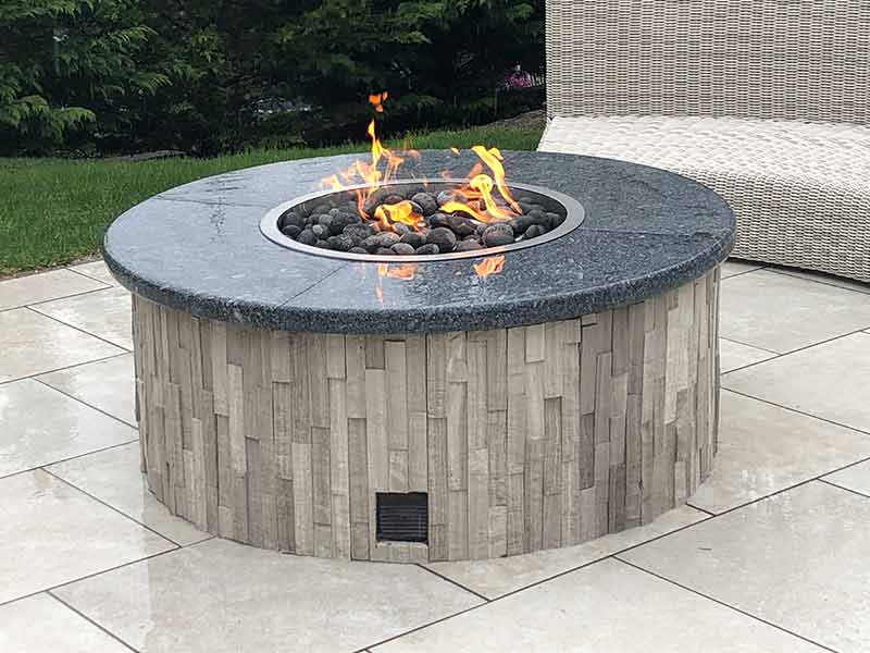 A California style firepit with custom vertical brickwork